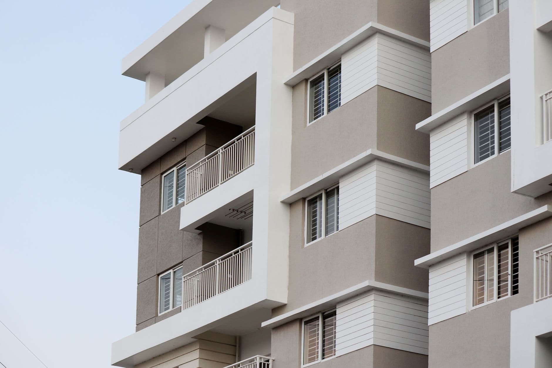 Real Estate Websites — A close-up of a modern apartment building facade in Hyderabad, India.
