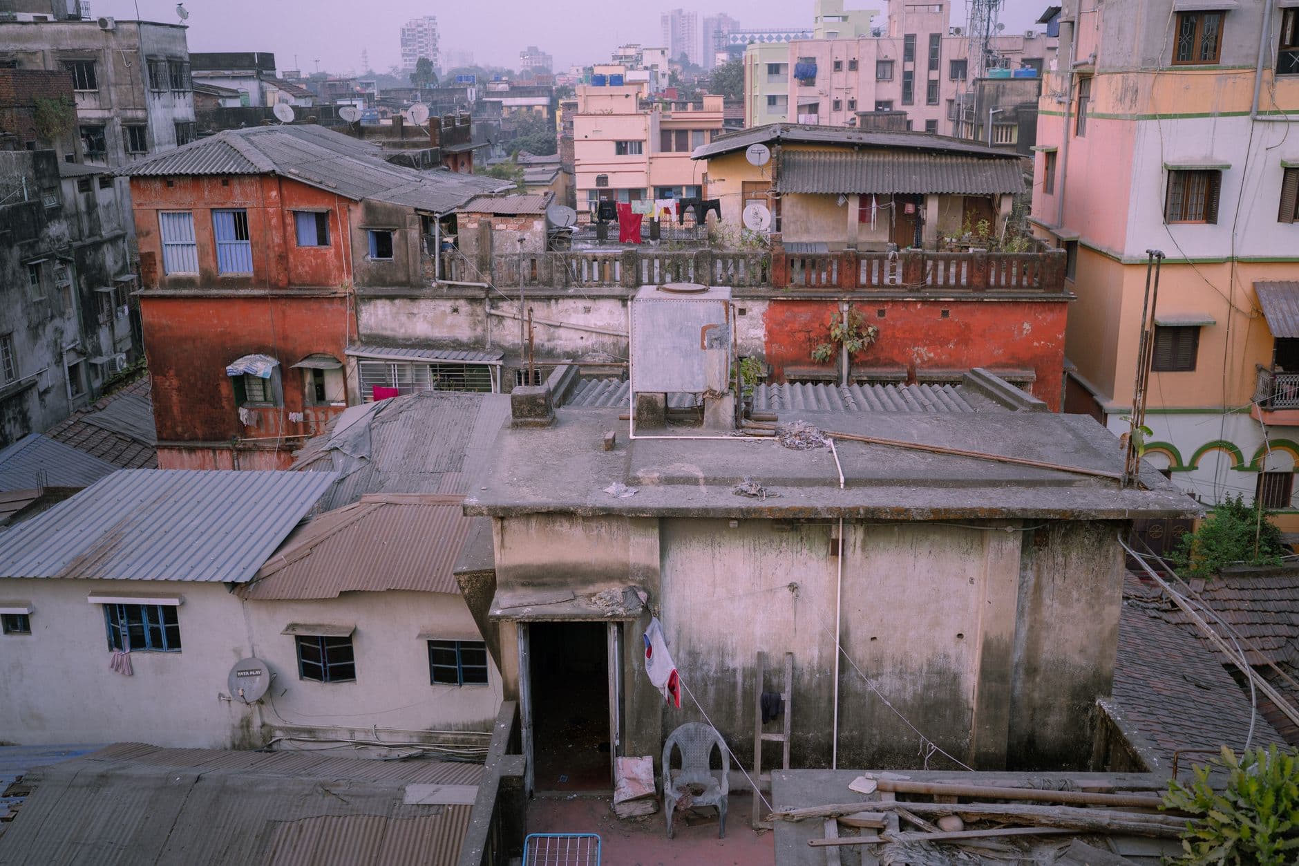 Real Estate Websites — Aerial view of urban rooftops in Kolkata, India showcasing vibrant city life.