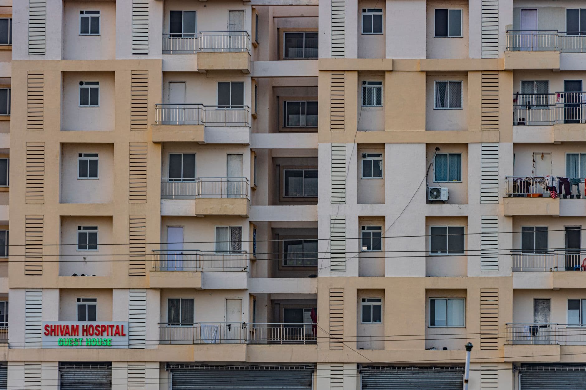 Real Estate Websites — Front view of a multi-story residential building facade in Hazaribagh, India.