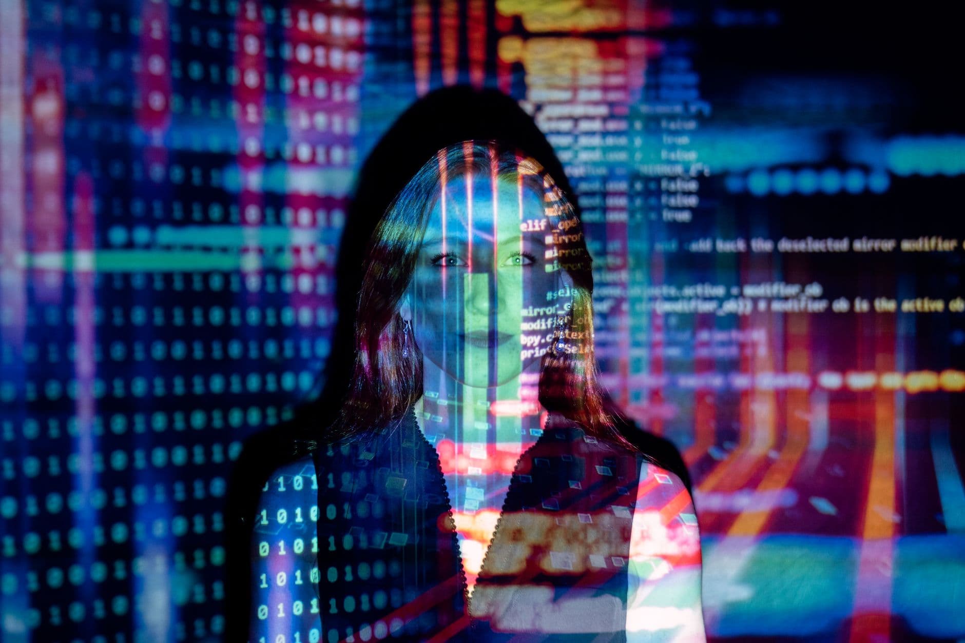 VPS Hosting for AI Startups — A woman with digital code projections on her face, representing technology and future concepts.
