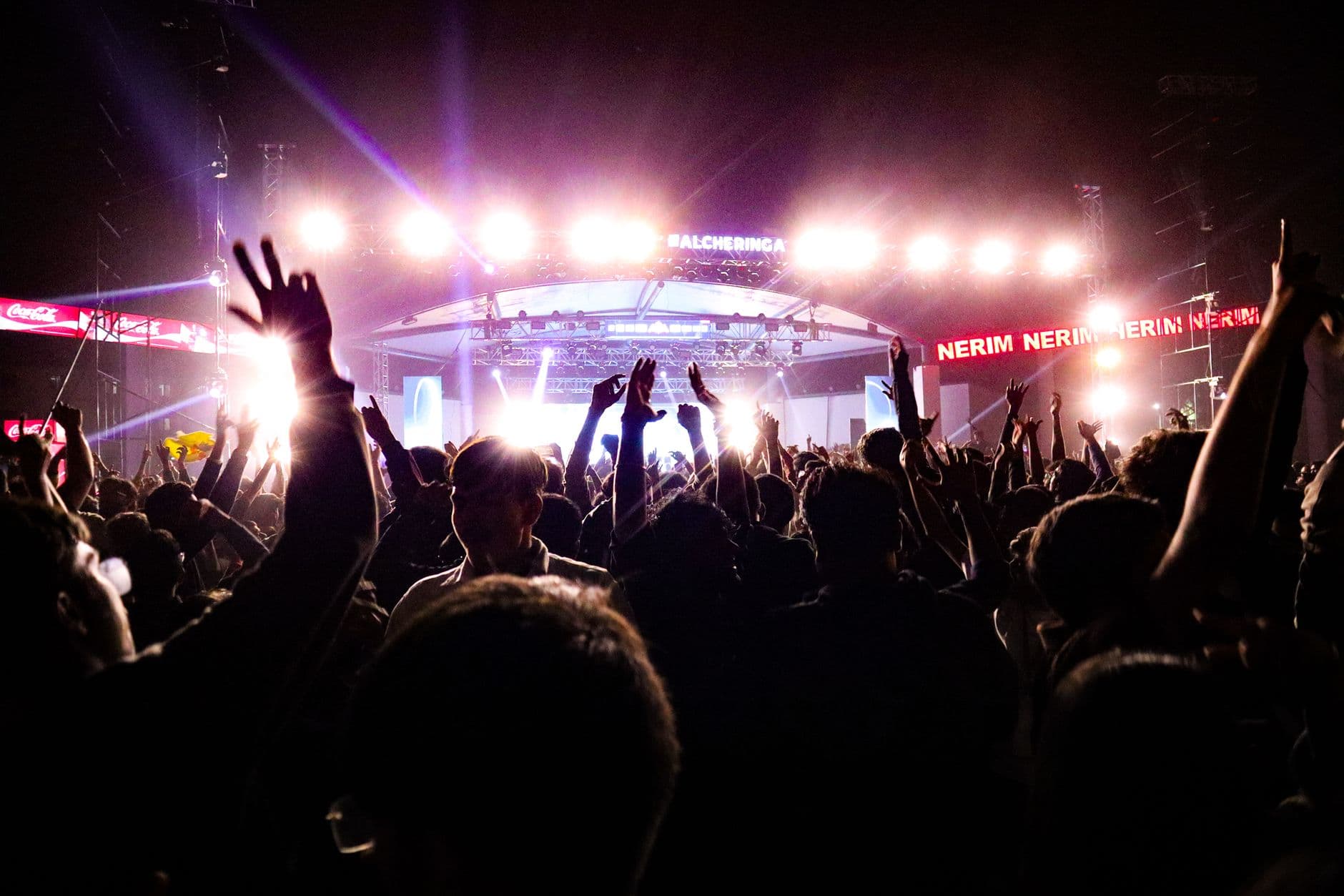 VPS Hosting for Ticket Booking Software — Energetic crowd enjoying a live concert under bright stage lights in Guwahati, India.