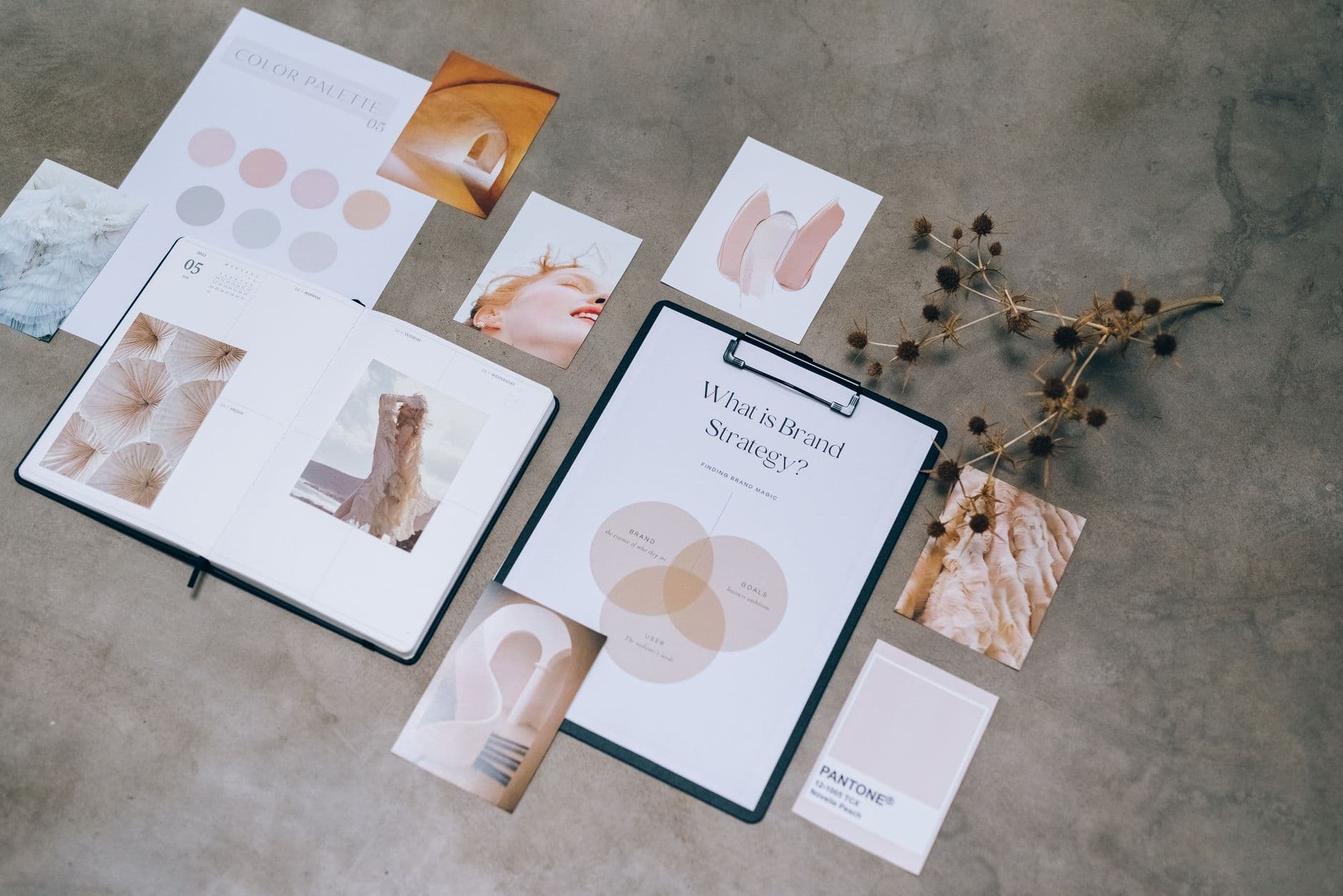 Branding — Flat lay of branding strategy materials with moodboard and color palette for creative design.