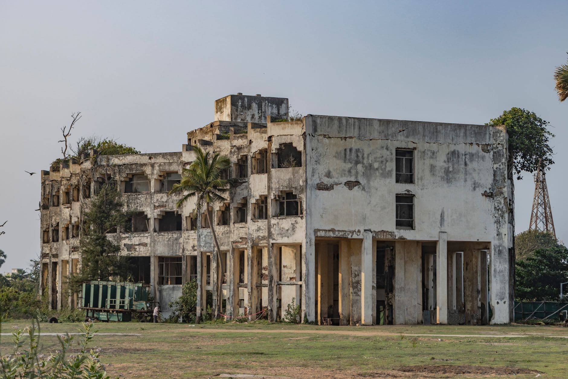 Hotel Booking Websites — Explore the abandoned Soviet-style architecture in Puri, India, weathered and overgrown.