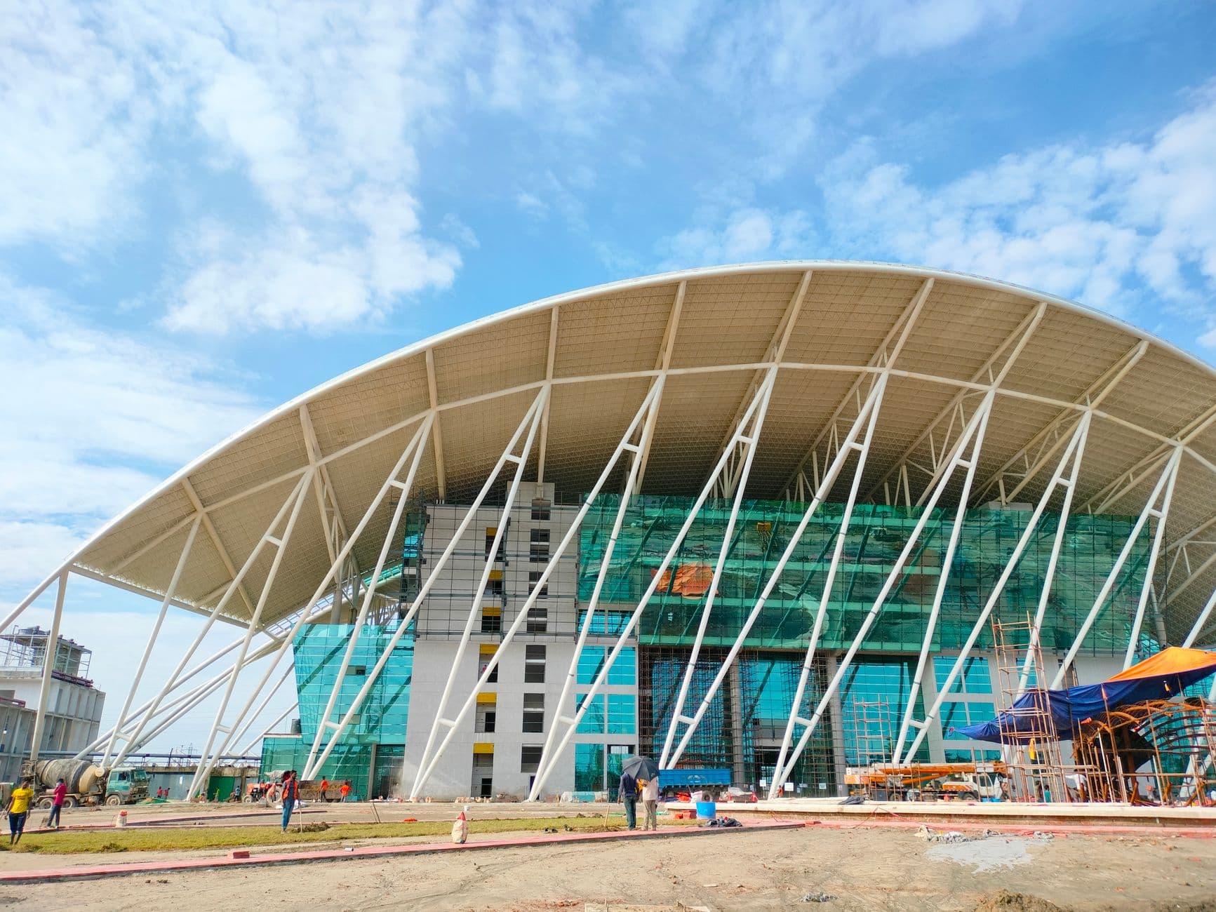 Website & Hosting for Builders — Contemporary building with unique design under construction in Bangalore, India.