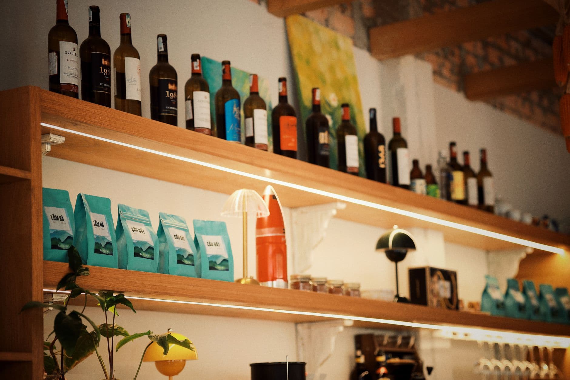 Website & Hosting for Cafes — Warm and inviting cafe shelf with wine bottles and coffee bags, creating a cozy atmosphere.